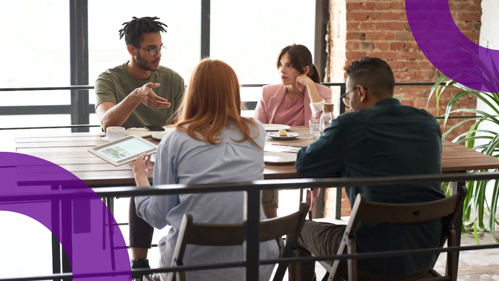 Dynamics 365 Building Business Case - Group of people sitting at table